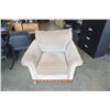Image 1 : BEIGE UPHOLSTERED PILLOWBACK ARMCHAIR WITH WOOD BASE
