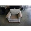 Image 1 : BEIGE UPHOLSTERED PILLOWBACK ARMCHAIR WITH WOOD BASE