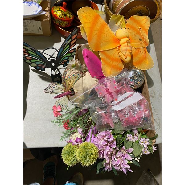 Box of butterfly decor and napkins rings and candle holder