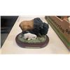 Image 3 : Chicken figure with grey rock statue and bird dish