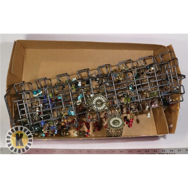 LARGE JEWELRY DISPLAY WITH DOZENS OF EARRINGS