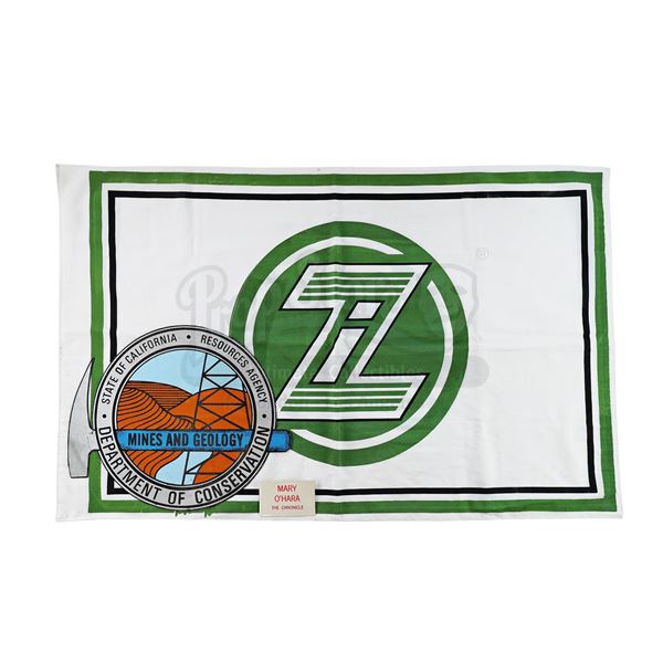 Lot # 792: VIEW TO A KILL, A (1985) - Zorin Industries Flag and Department of Conservation Decal