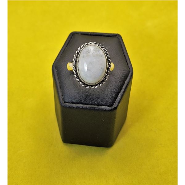 28)  OVAL MOON STONE RING WITH TWISTED