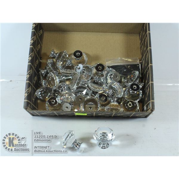 BOX OF CRYSTAL DOOR HANDLES AND MOUTING SCREWS.