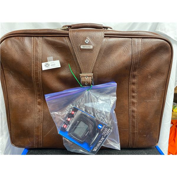 Large Leather Suitcase with a Westclox Travel Alarm Clock