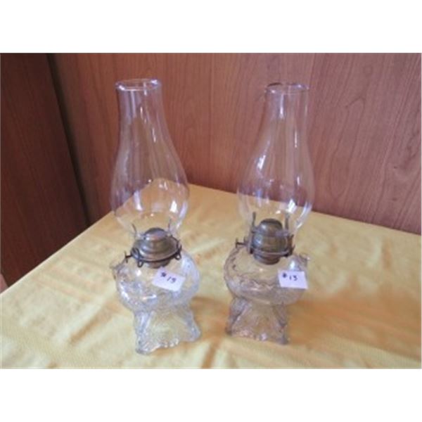 2 SQUARE BASE CLEAR GLASS PATTERED OIL LAMPS WITH CHIMNEYS