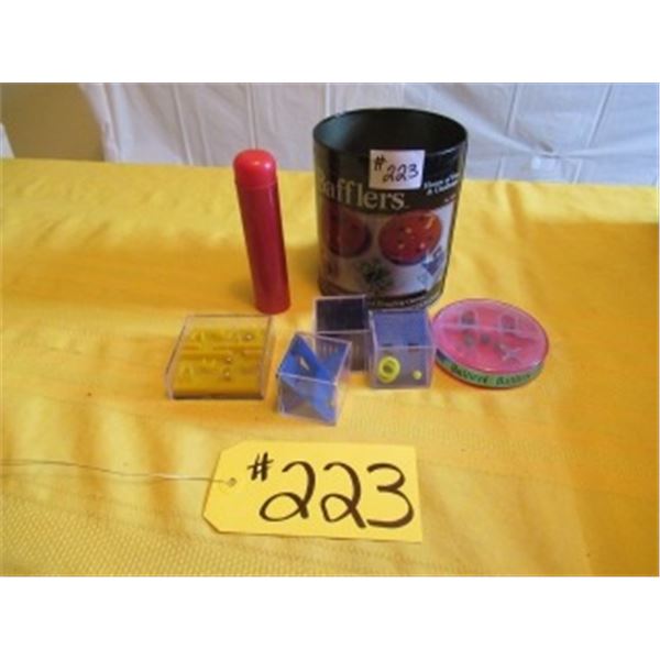 TIN WITH ASSORTED BRAIN TEASER MARBLE PUZZLES