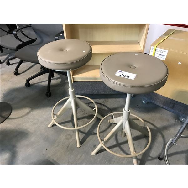 2 BEIGE GAS LIFT ROUND STOOLS