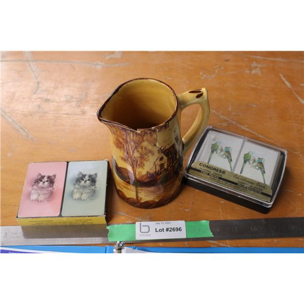 Medalta Pitcher with Cracks and Decks of Cards