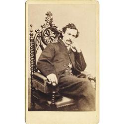CDV OF JOHN WILKES BOOTH SEATED IN CHAIR 1865.