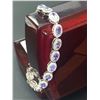 Image 1 : Natural Tanzanite Tennis Bracelet with 10.45 CARAT weight of stones set in .925 Silver with appraisa