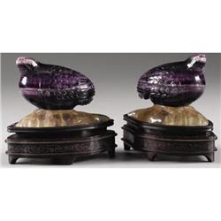 Pair of carved amethyst vessels