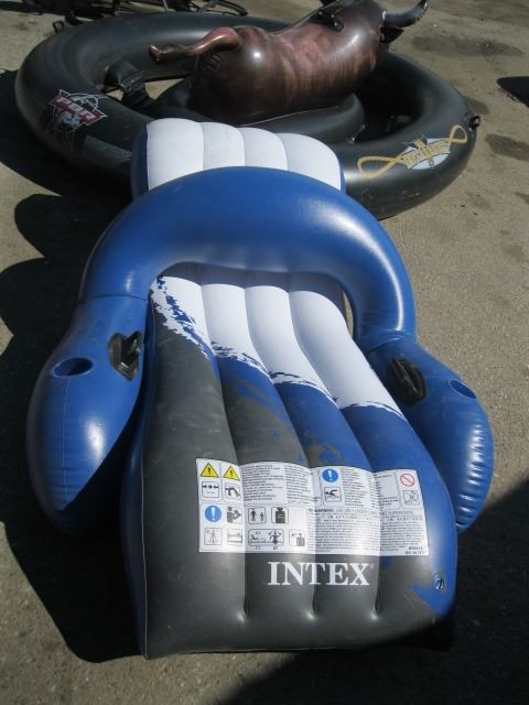 INFLATABLE RAFT & A GREEN RIDING DRAGON