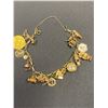 Image 1 : GOLD TONE CHARM BRACELET (MAY BE SOME GOLD CHARMS)