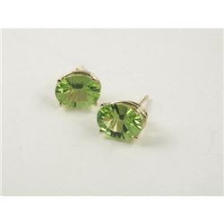 EARRINGS: Lady's 14k earrings set with peridots. Peridots measure approximately 3ct each. No apprais