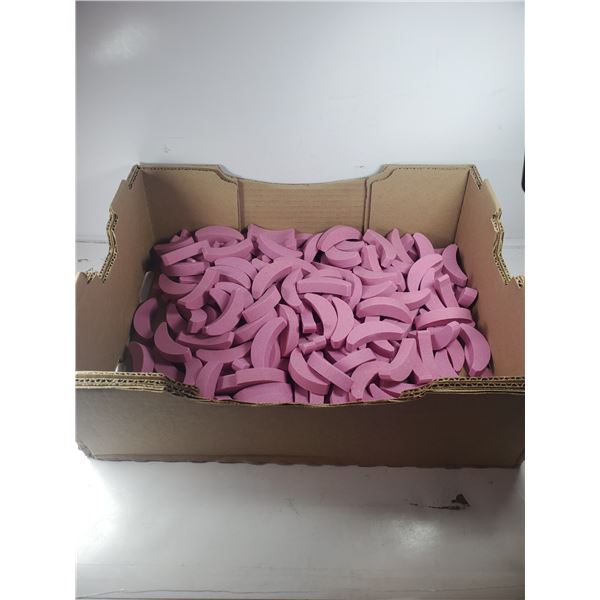 LARGE FLAT OF CURVED GRINDING STONES.