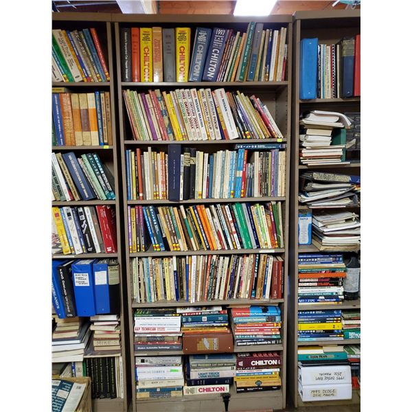 SHELF LOT OF ASSORTED VEHICLE SERVICE MANUALS.