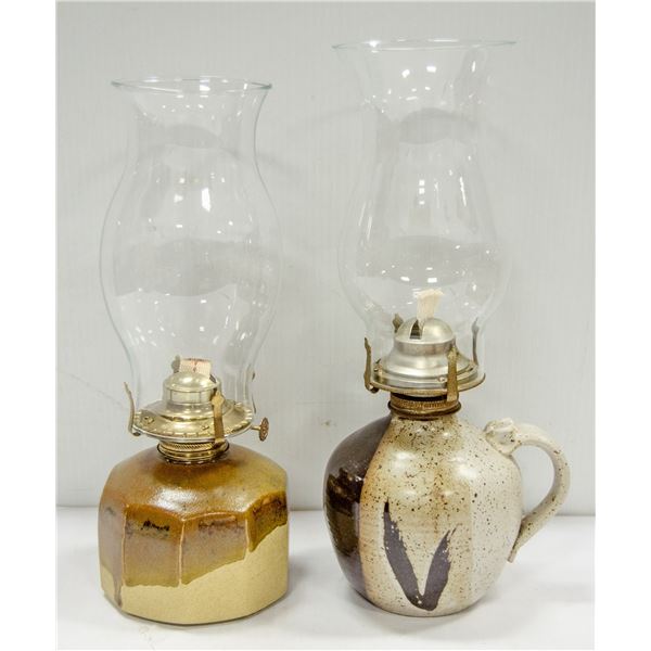 TWO VINTAGE POTTERY OIL LAMPS.