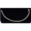 Image 1 : 14K GOLD TENNIS BRACELET WITH CLEAR STONES,