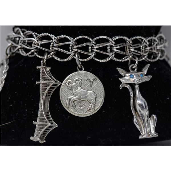 STERLING SILVER CHARM BRACELET WITH 9 CHARMS, 7"