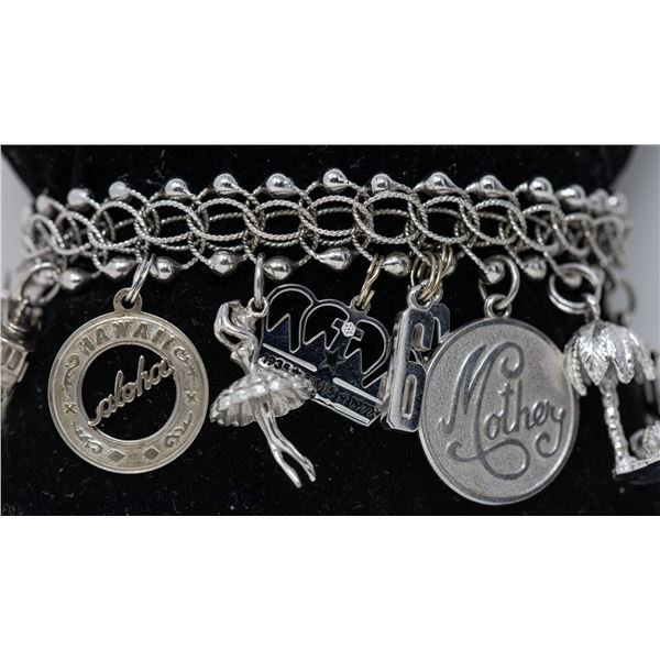STERLING SILVER CHARM BRACELET WITH 16 CHARMS