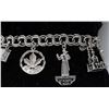 Image 1 : STERLING SILVER CHARM BRACELET WITH 8 CHARMS,