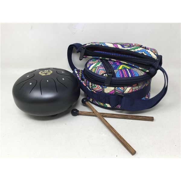 Black steel tongue drum with sticks and carrying case