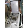 Image 2 : Stainless steel natural gas barbecue with side prep tray on left and burner on the right, made by St