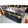 Image 1 : Semi contemporary metal bound steamer trunk with black finish and faux brass accents, has had pad lo