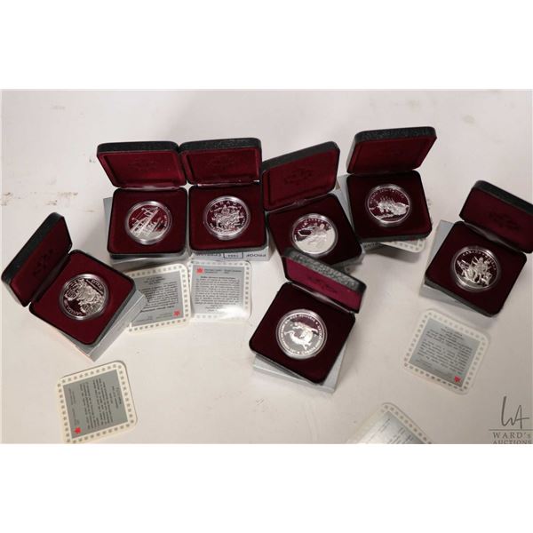 Seven boxed Canadian silver dollar coins including 1988, 1989, 1990, 1991, 1992, 1993 and 1994