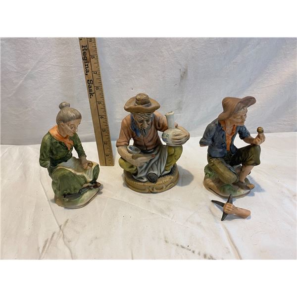 Figurines two have  broken arms