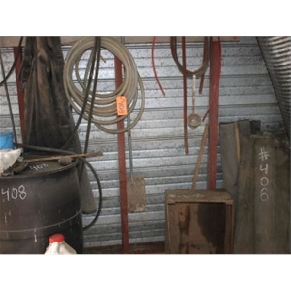 MISC HOSE, BLACK BARREL, CANVAS AGAINST SOUTH WALL