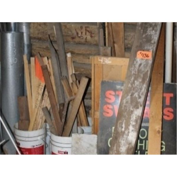 QUANTITY OF LUMBER AGAINST THE WALL