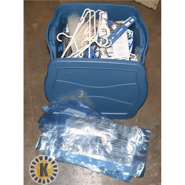 SMALL TOTE FULL OF HANGERS AND A FEW PLASTIC BAGS