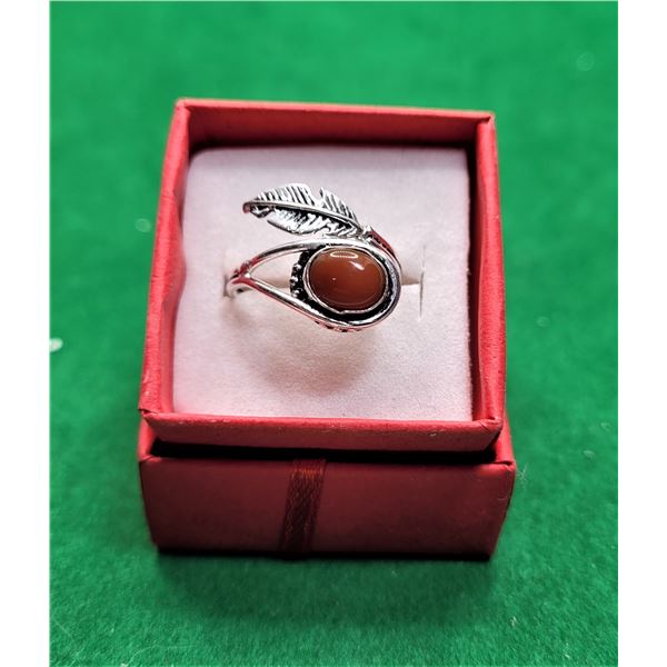 16)  CARMEL COLORED ONYX BYPASS RING SET IN