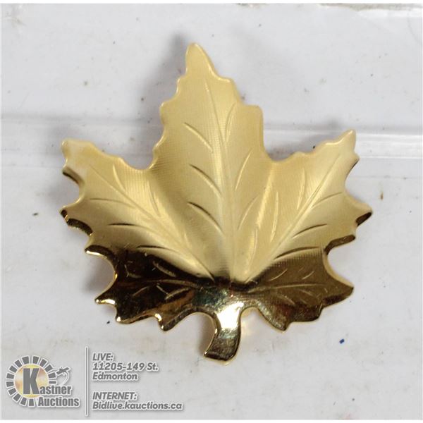 A GOLD CANADIAN MAPLE LEAF
