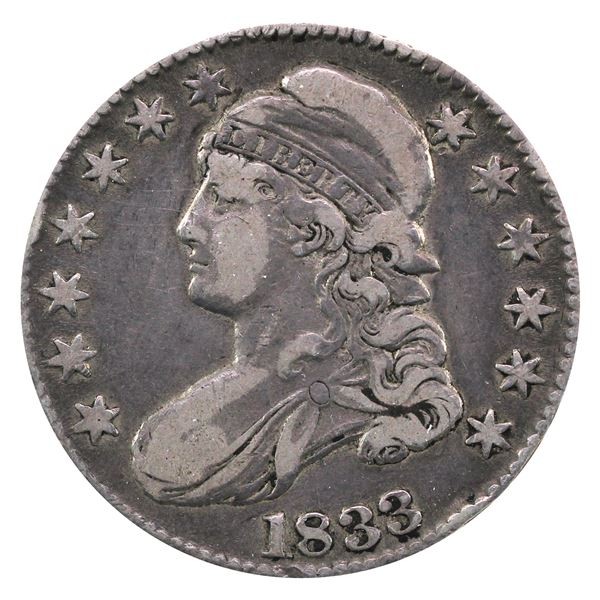 United States 1833 Capped Bust Half Dollar in VF-EF condition. An attractive natural grey tones thro