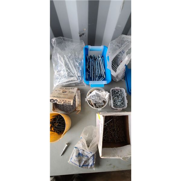 BAAG OF DRYWALL SPACER SCREWS, CONCERETE ANCHOR BOLTS, WIRE STRAPPING AND MISC.