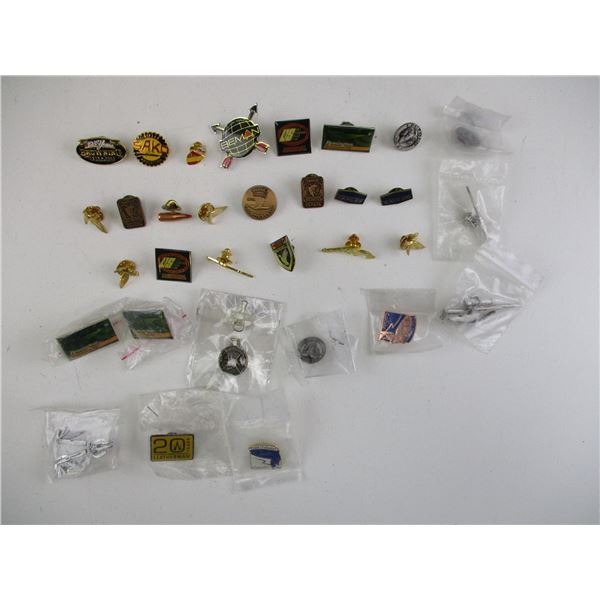 ASSORTED GUN PINS ETC LOT