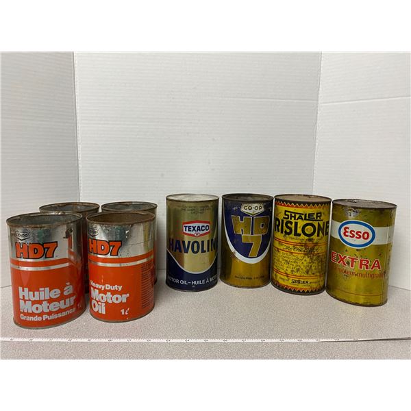 8 empty oil cans