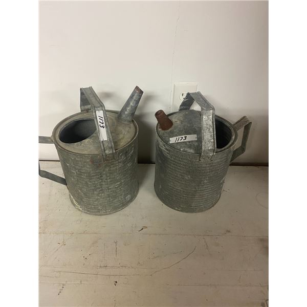 2 metal watering cans