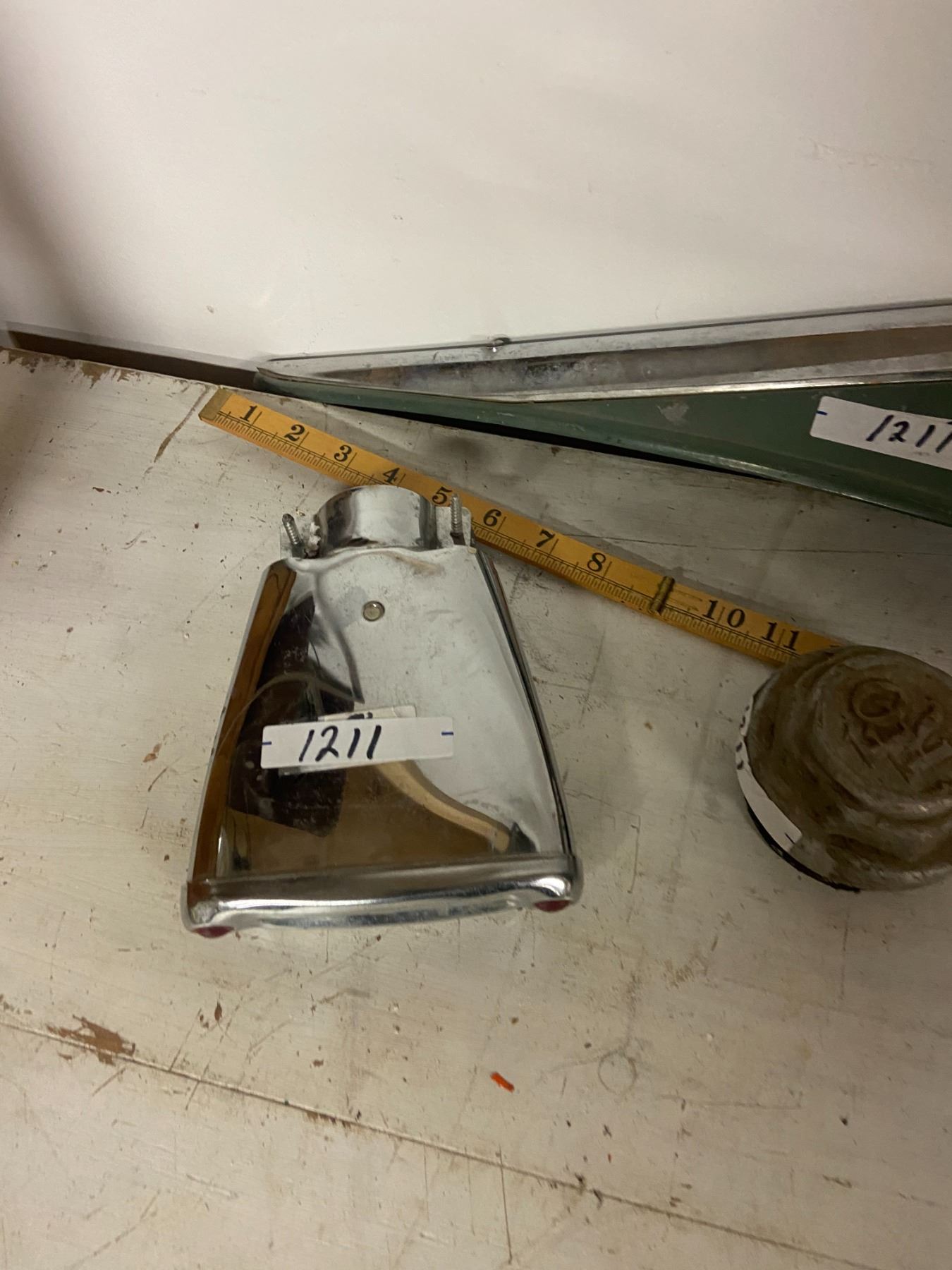 vintage tail lights, REO hub cap, tail pipe bling' Schmalz Auctions