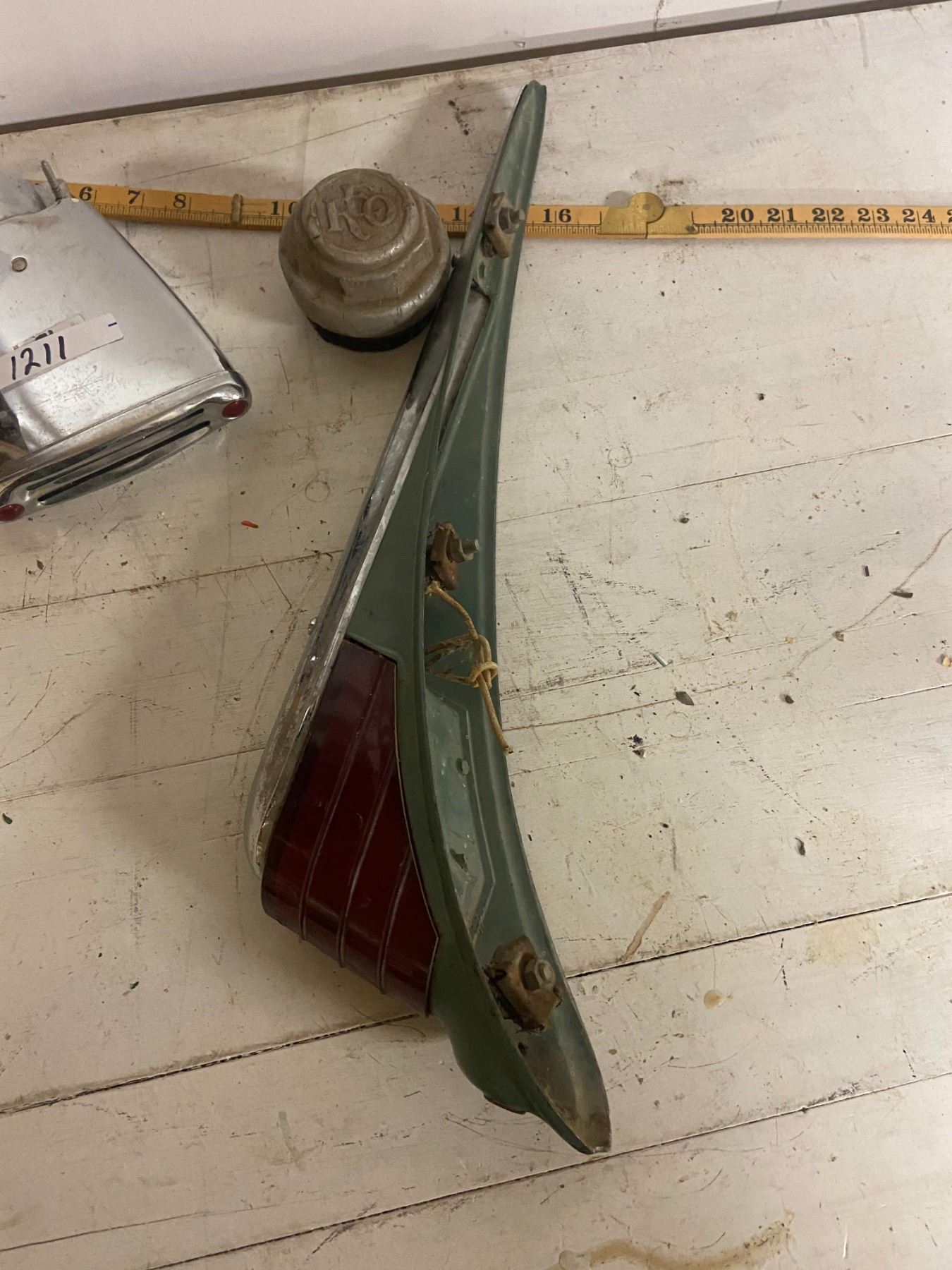 vintage tail lights, REO hub cap, tail pipe bling' Schmalz Auctions