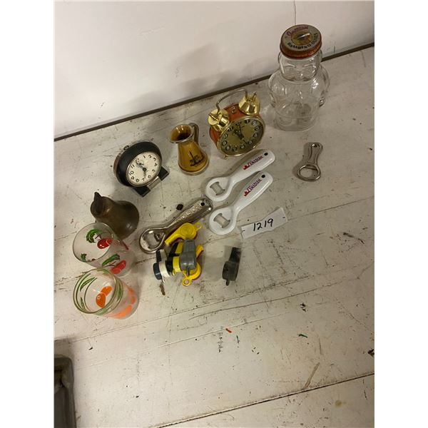 lot of collectibles -alarm clocks, brass bell, toy whistles, jar, vase