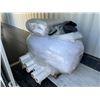 Image 1 : 8 ROLLS OF WHITE NYLON FABRIC, LARGE BAG OF STUFFING MATERIAL, PILLOWS AND BLANKETS