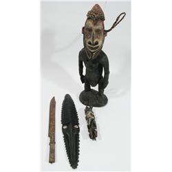A COLLECTION OF FOUR MELANESIAN ARTEFACTS