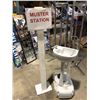 Image 1 : Muster station sign & portable pedestal sink from the love show