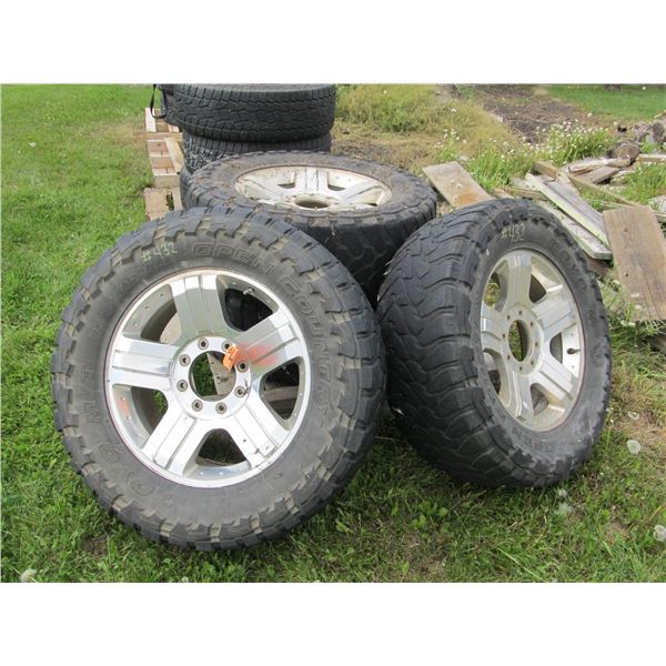 4 TOYO OPEN COUNTRY 35X12.5X20 TIRES ON ALUMINUM RIMS