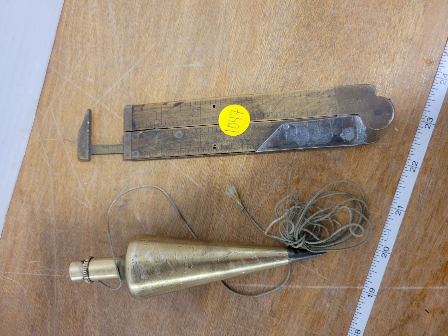 large brass plumb bob & 12" brass wood ruler Schmalz Auctions