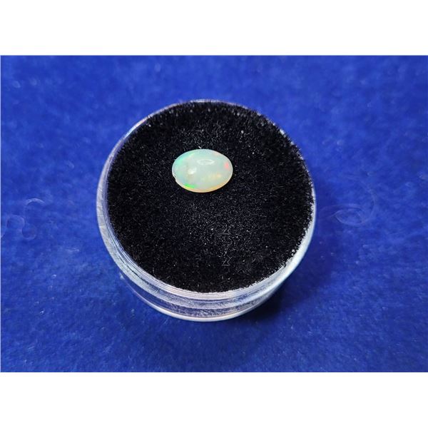 23)  NATURAL OVAL .605 CT RAINBOW WHITE